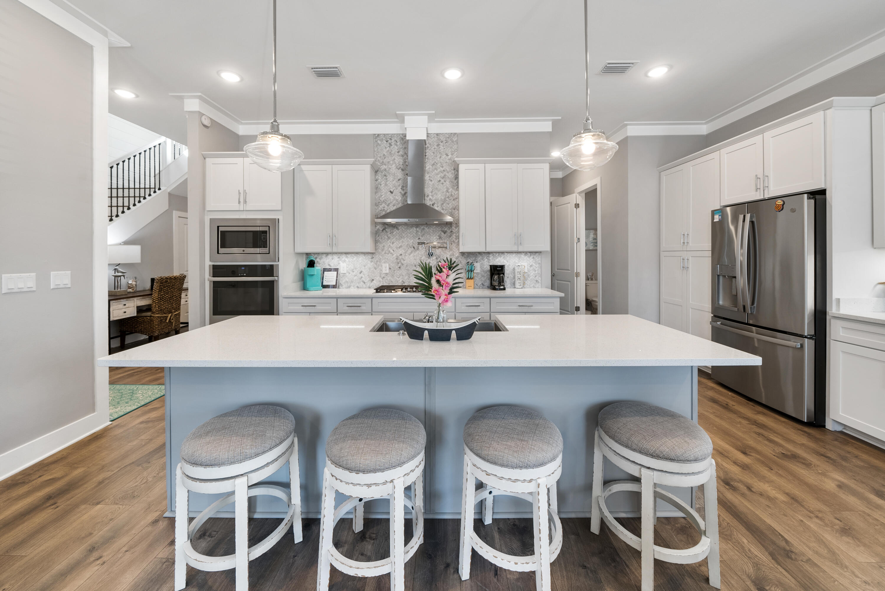 173 West Willow Mist Road Inlet Beach, FL 32461 - Photo 7 of 51 a kitchen with a dining table chairs refrigerator and microwave