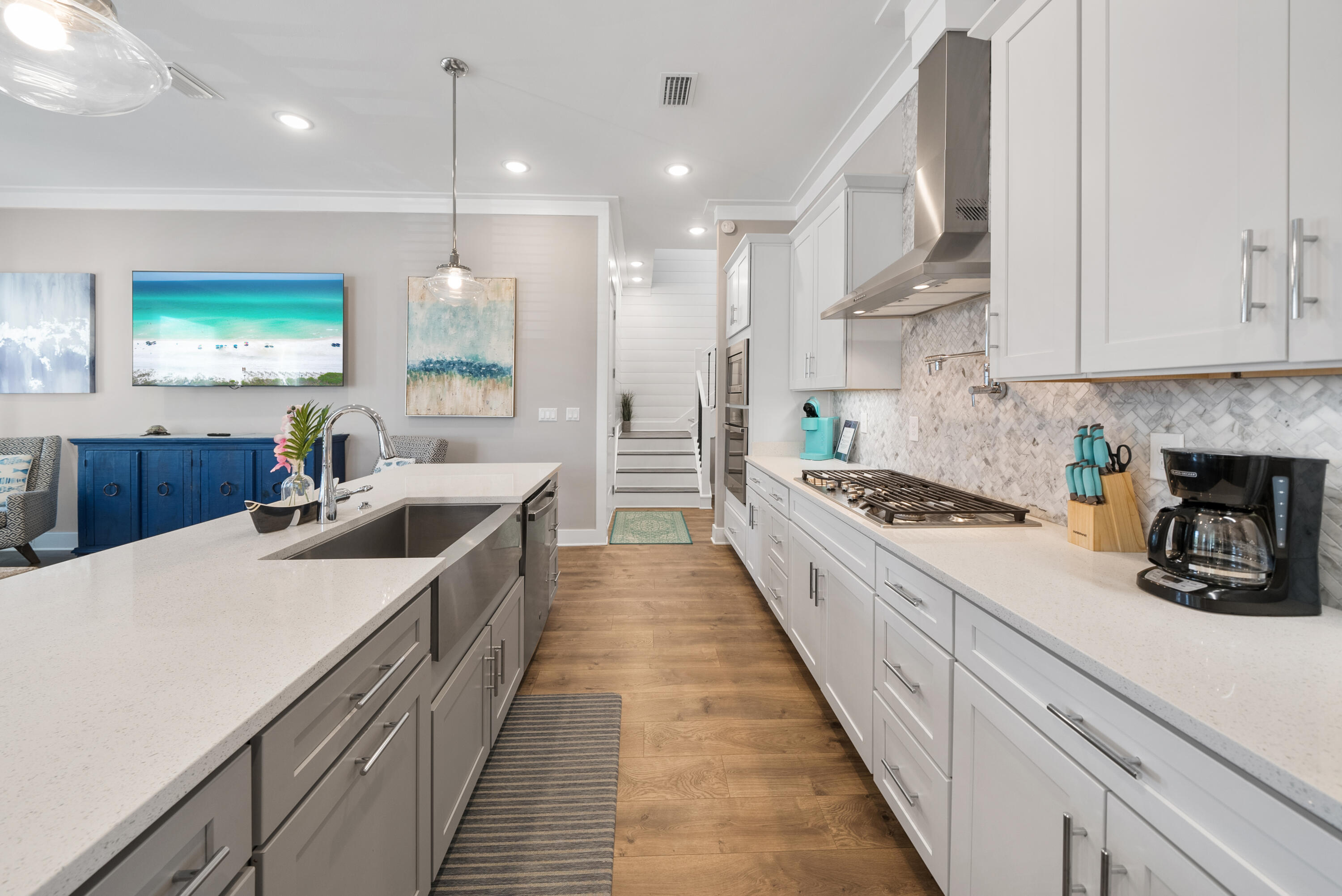 173 West Willow Mist Road Inlet Beach, FL 32461 - Photo 8 of 51 a large kitchen with kitchen island a stove a sink a refrigerator and white cabinets