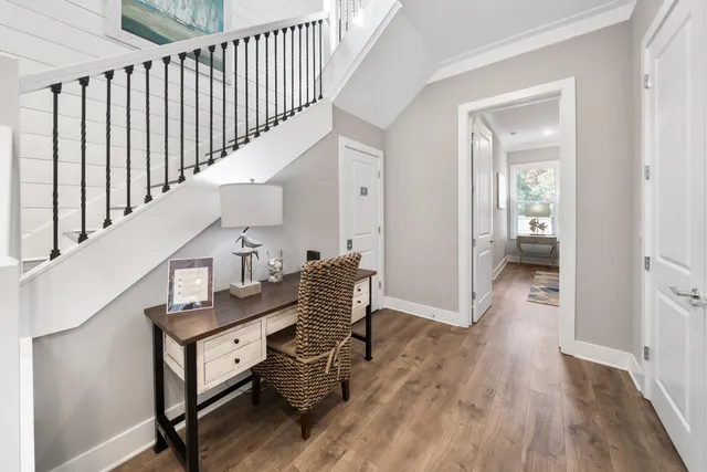 a view of entryway with wooden floor and stairs