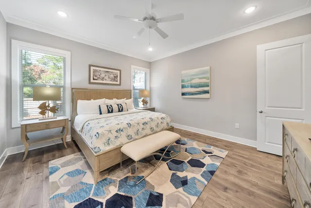 a bedroom with a bed and a painting on the wall