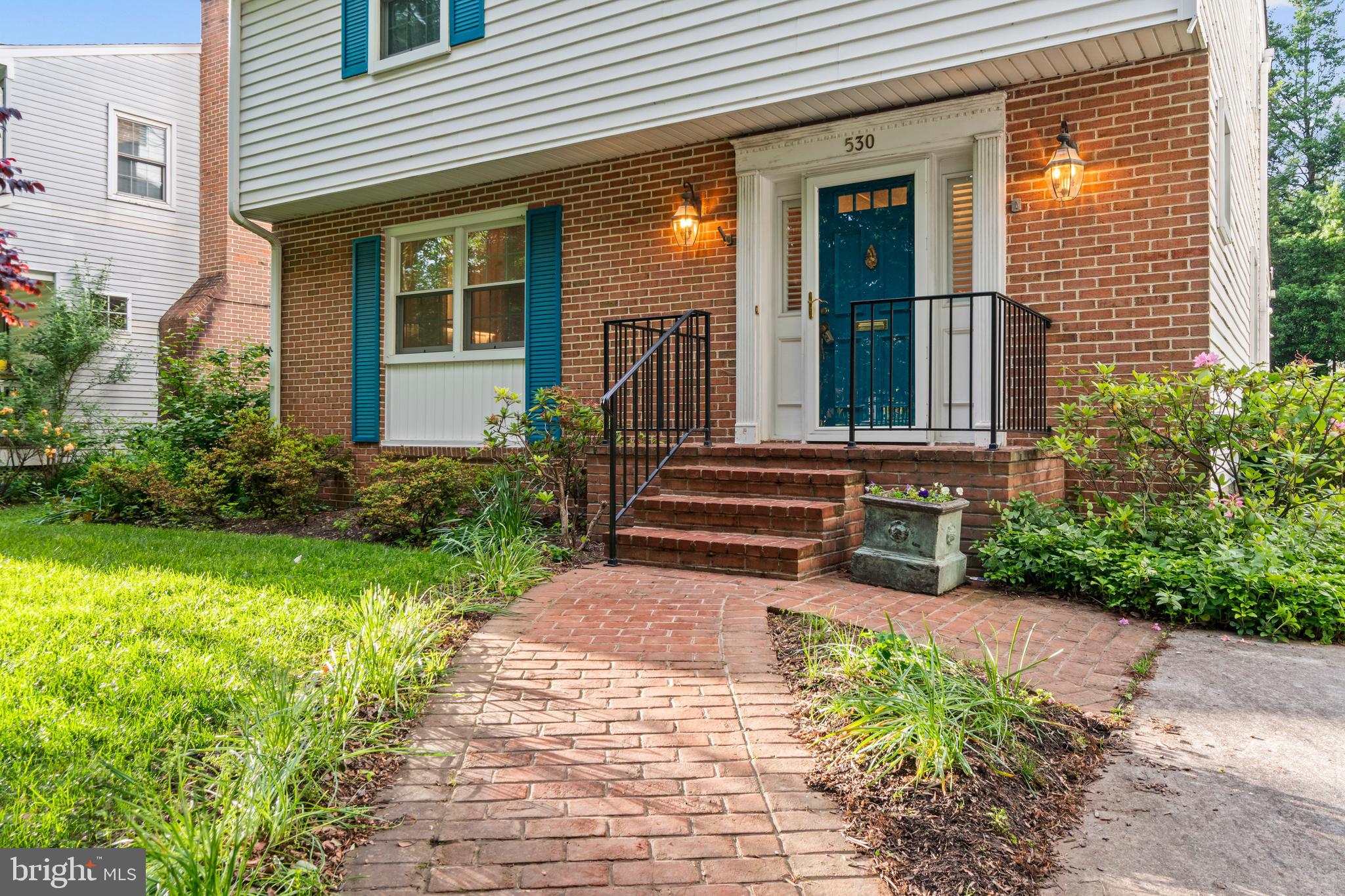530 Anneslie Road Baltimore, MD 21212 - Photo 31 of 38 a view of a house with potted plants and a bench