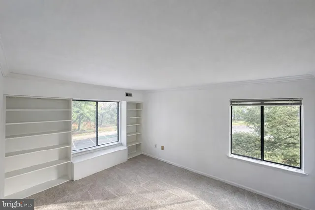 an empty room with windows