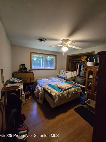 a bedroom with a bed and a table