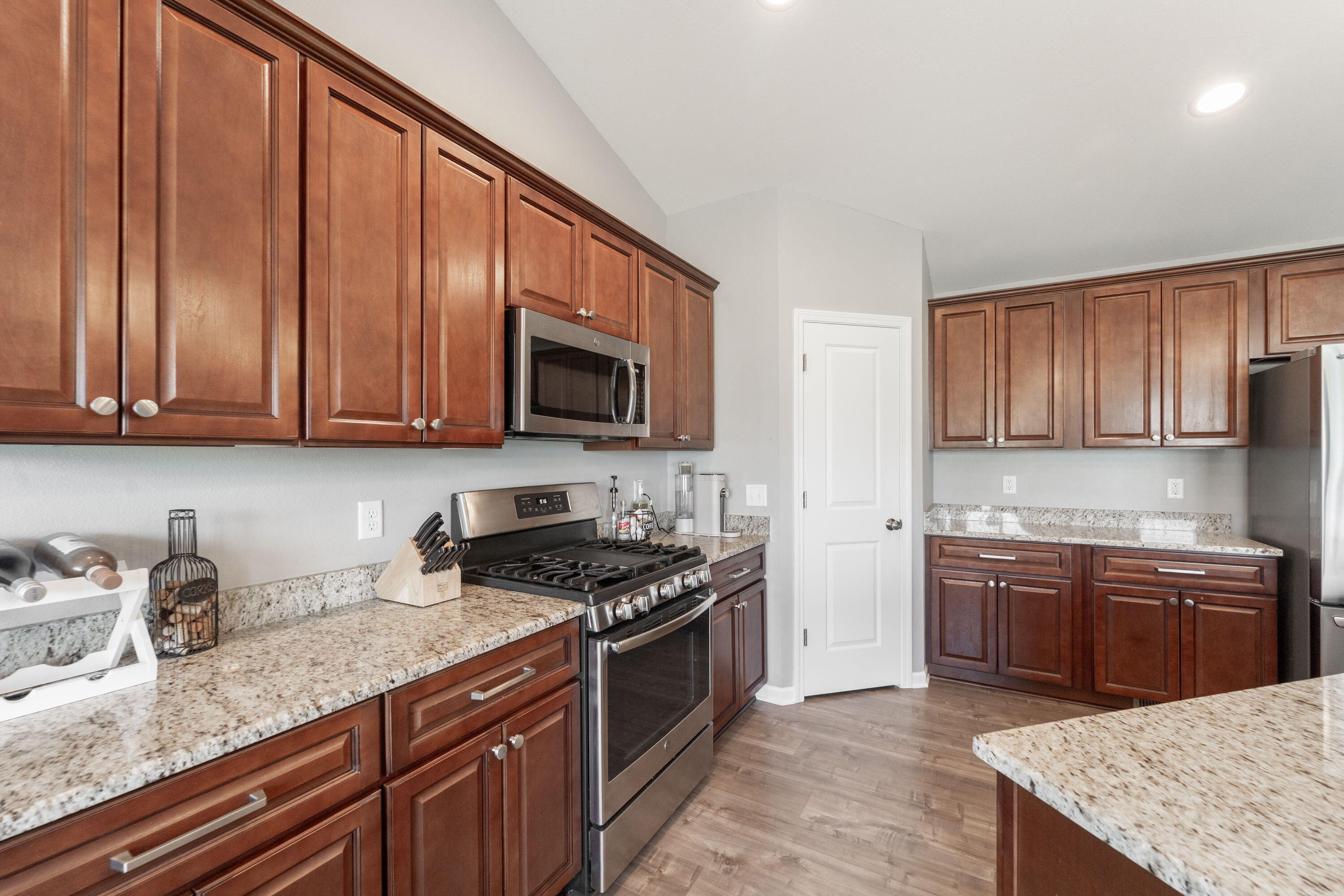 5202 Cornerstone Way Mount Pleasant, WI 53403 - Photo 21 of 29 Quartz countertops, ample cabinetry, and stainless appliances