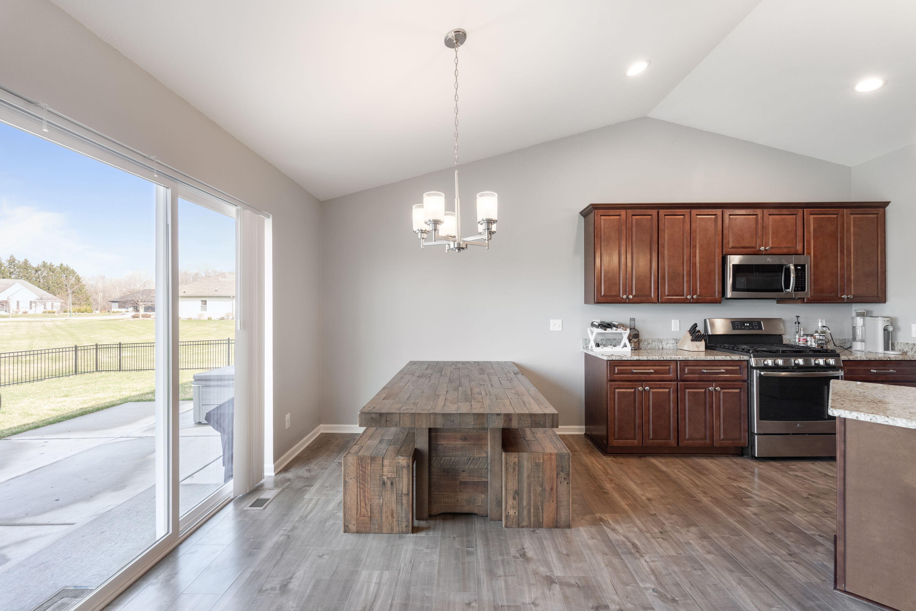 5202 Cornerstone Way Mount Pleasant, WI 53403 - Photo 23 of 29 Open dining area with direct access to patio and backyard