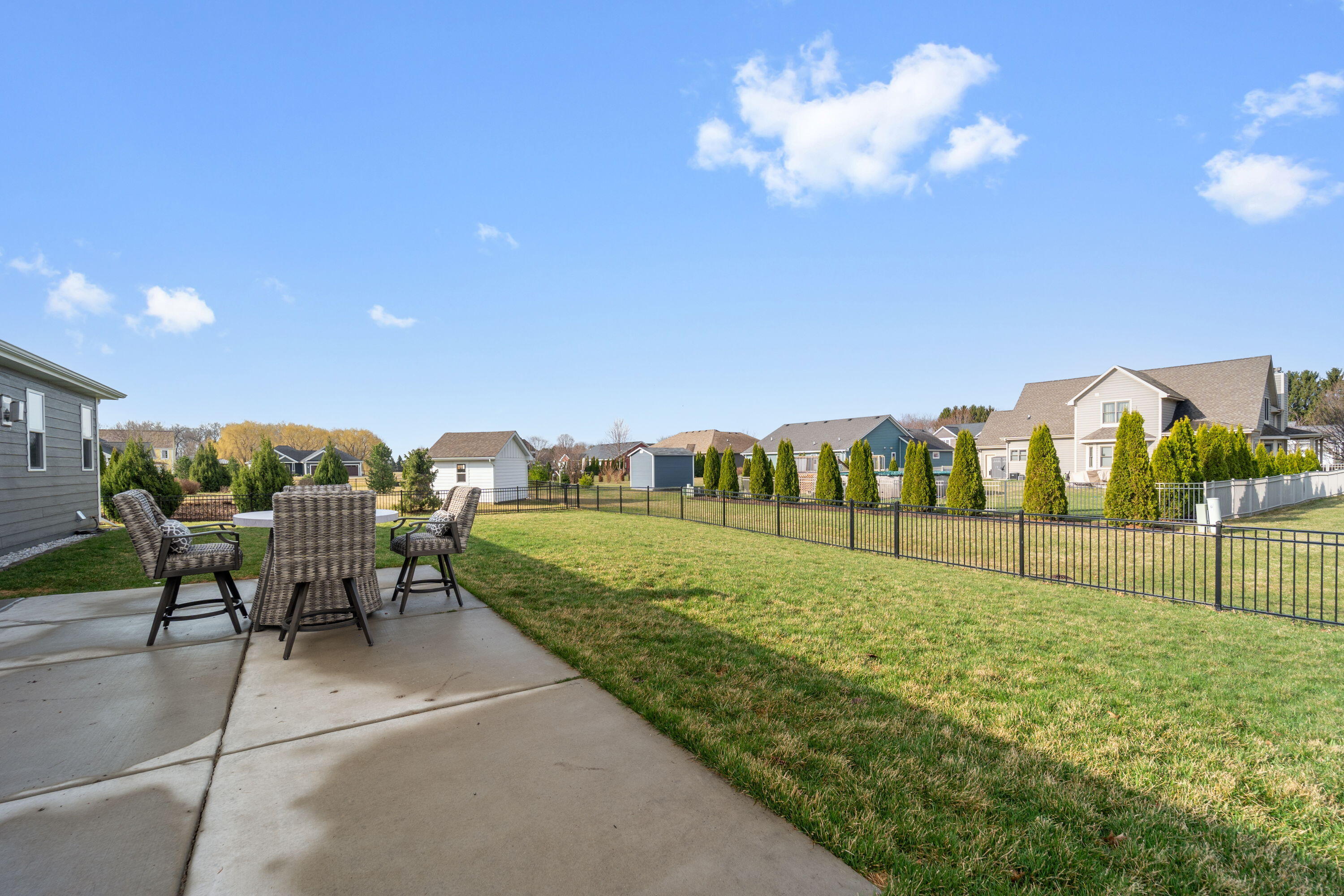 5202 Cornerstone Way Mount Pleasant, WI 53403 - Photo 25 of 29 Spacious patio and yard ideal for gatherings and outdoor living
