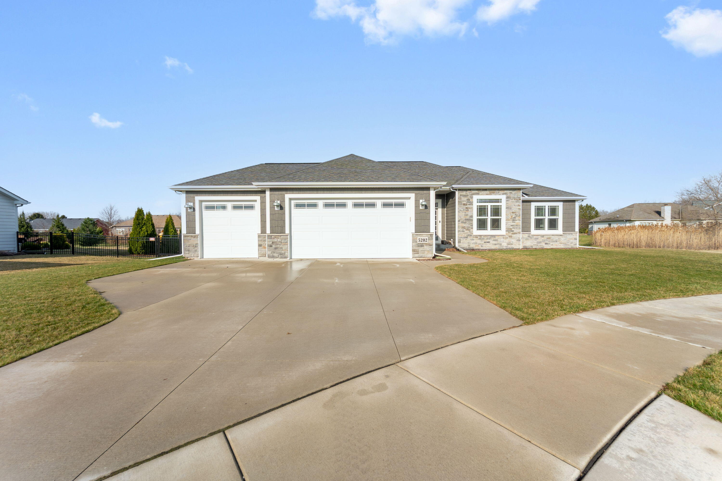5202 Cornerstone Way Mount Pleasant, WI 53403 - Photo 27 of 29 Spacious driveway and 3-car garage for added convenience