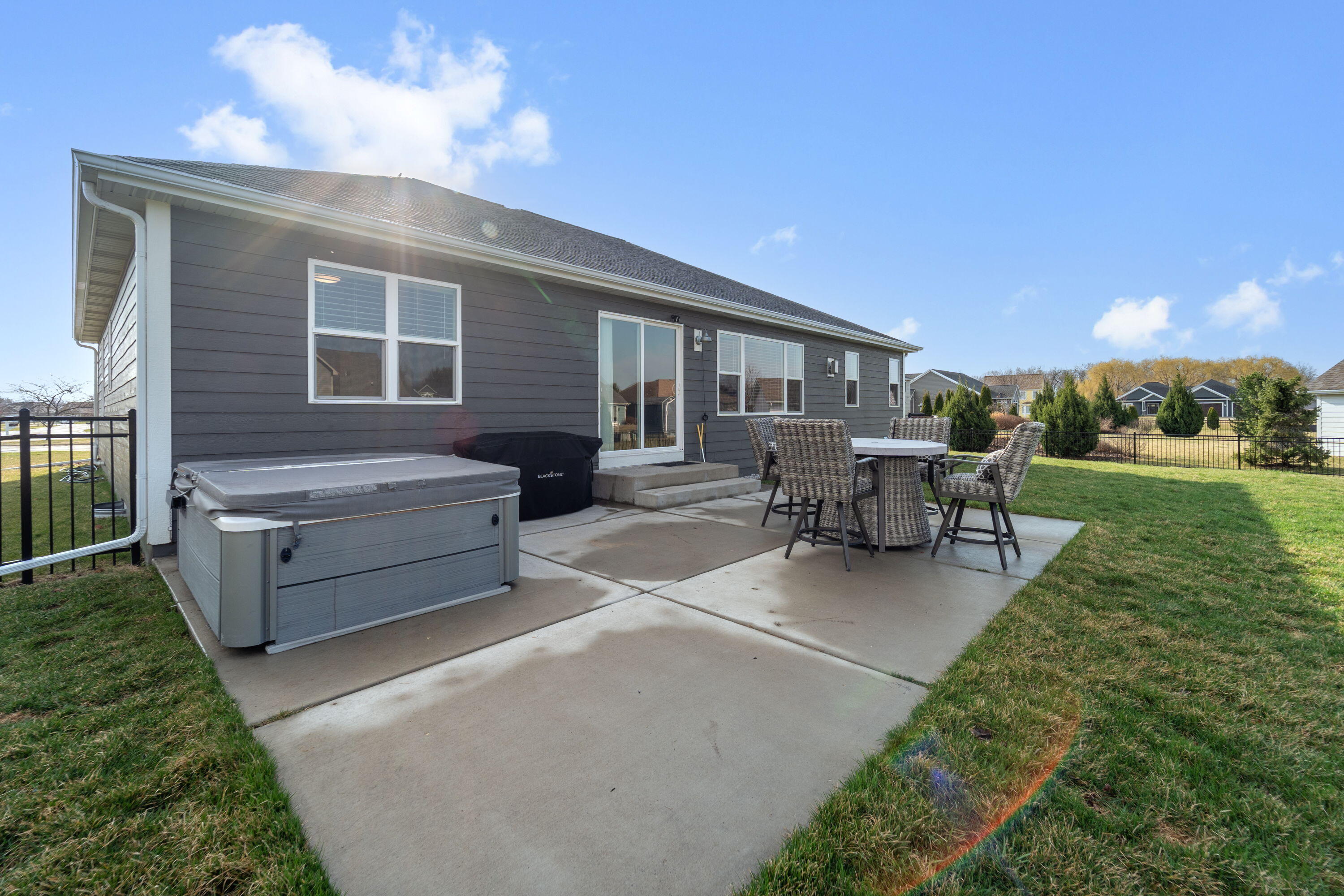 5202 Cornerstone Way Mount Pleasant, WI 53403 - Photo 2 of 29 Private patio with included hot tub—perfect for relaxing nights