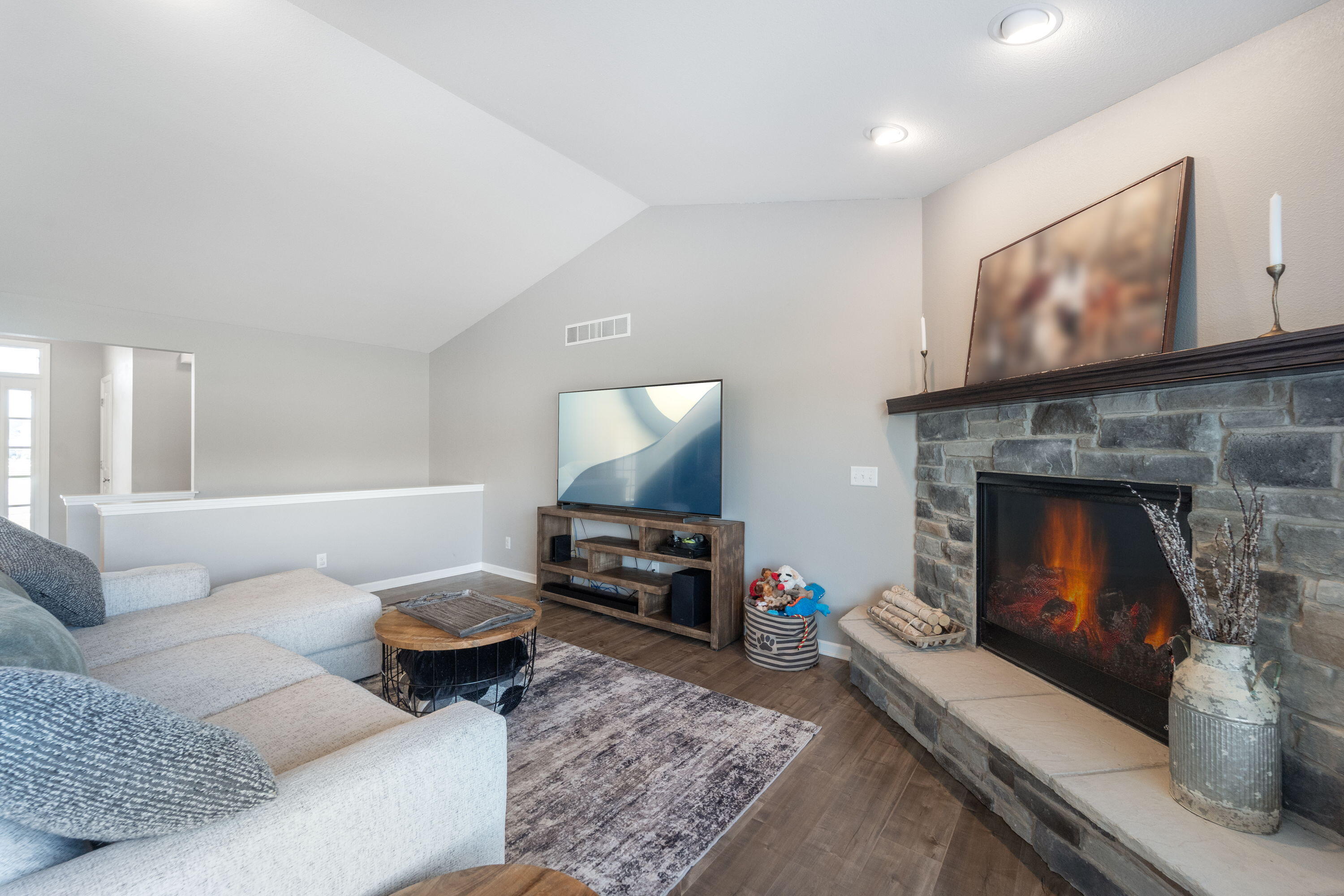 5202 Cornerstone Way Mount Pleasant, WI 53403 - Photo 4 of 29 Inviting living room with gas fireplace and vaulted ceilings
