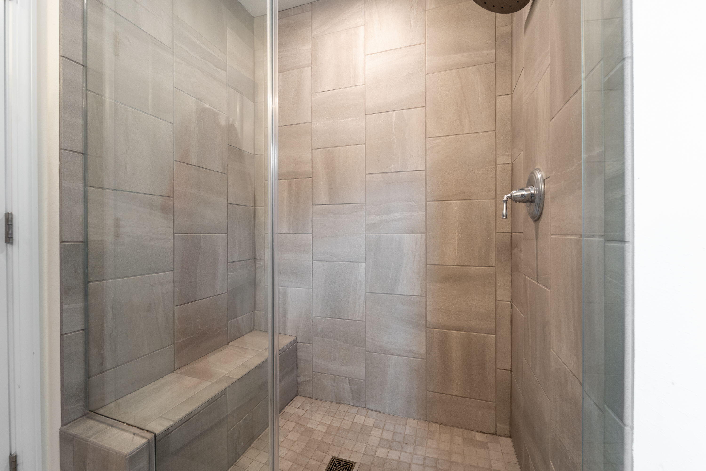5202 Cornerstone Way Mount Pleasant, WI 53403 - Photo 9 of 29 Large tiled shower with bench seating and modern finishes