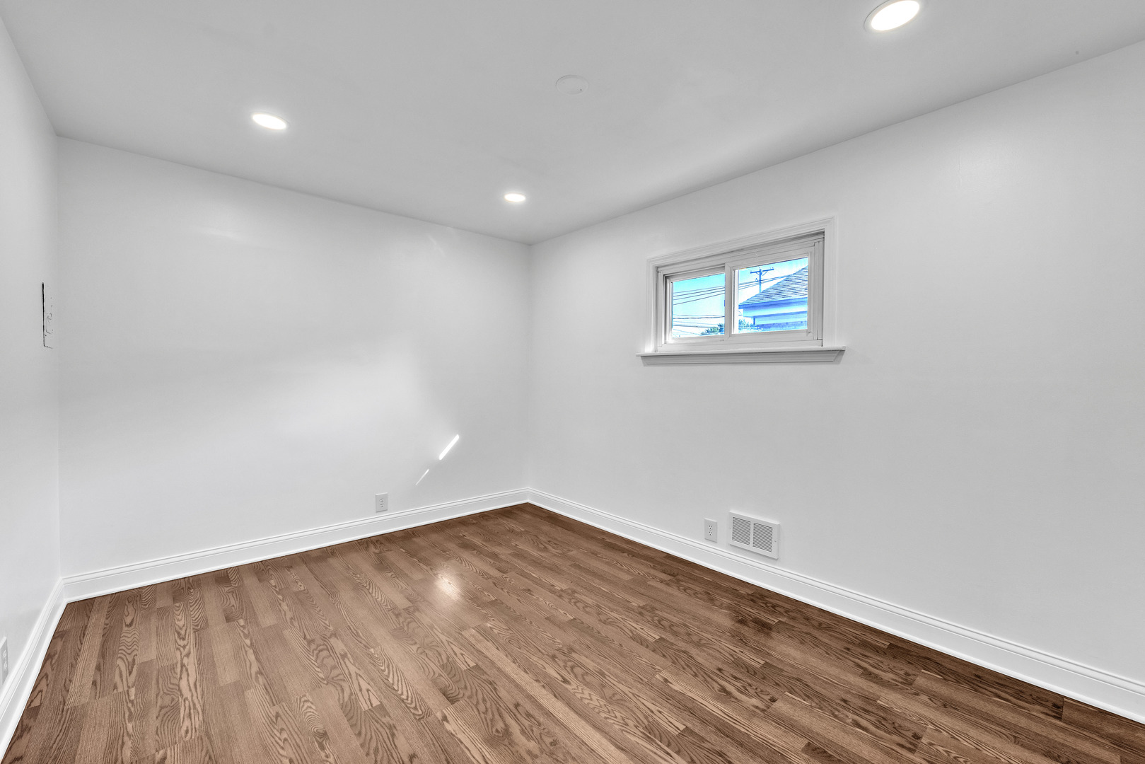 7817 South Kenton Avenue Chicago, IL 60652 - Photo 15 of 29 a view of a room with wooden floor and window