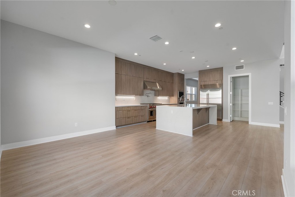 20637 West Hummingbird Porter Ranch Porter Ranch, CA 91326 - Photo 17 of 53 a view of kitchen with wooden floor