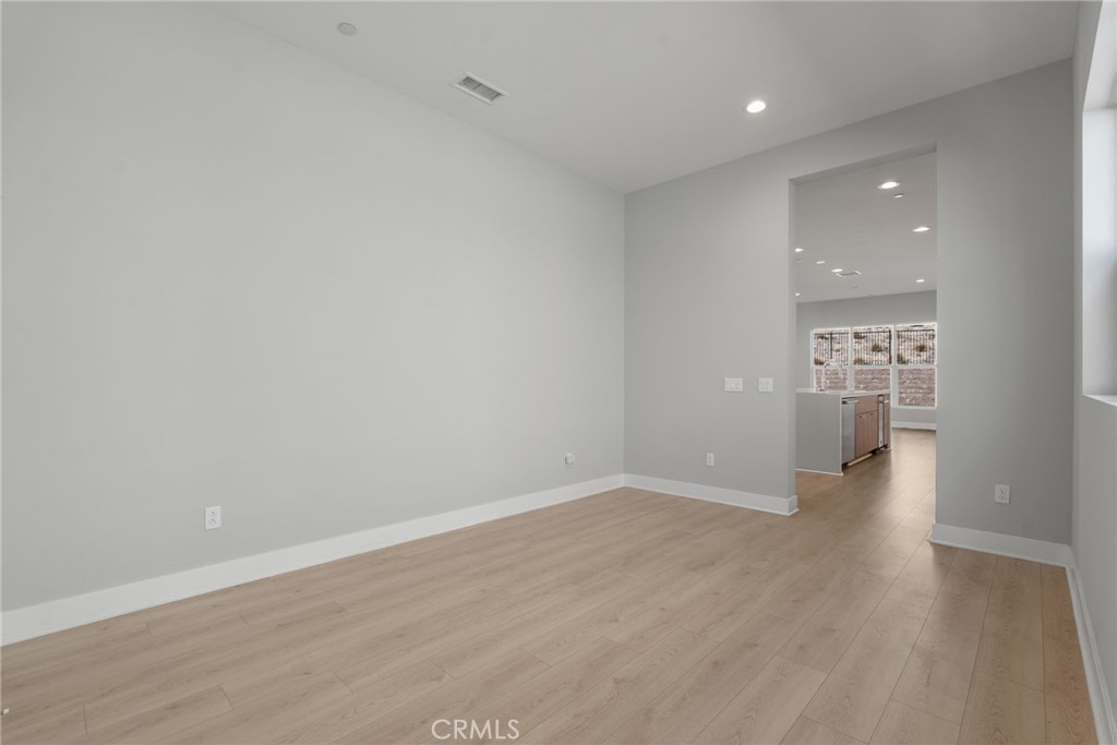 20637 West Hummingbird Porter Ranch Porter Ranch, CA 91326 - Photo 19 of 53 a view of a hallway with wooden floor and a bathroom