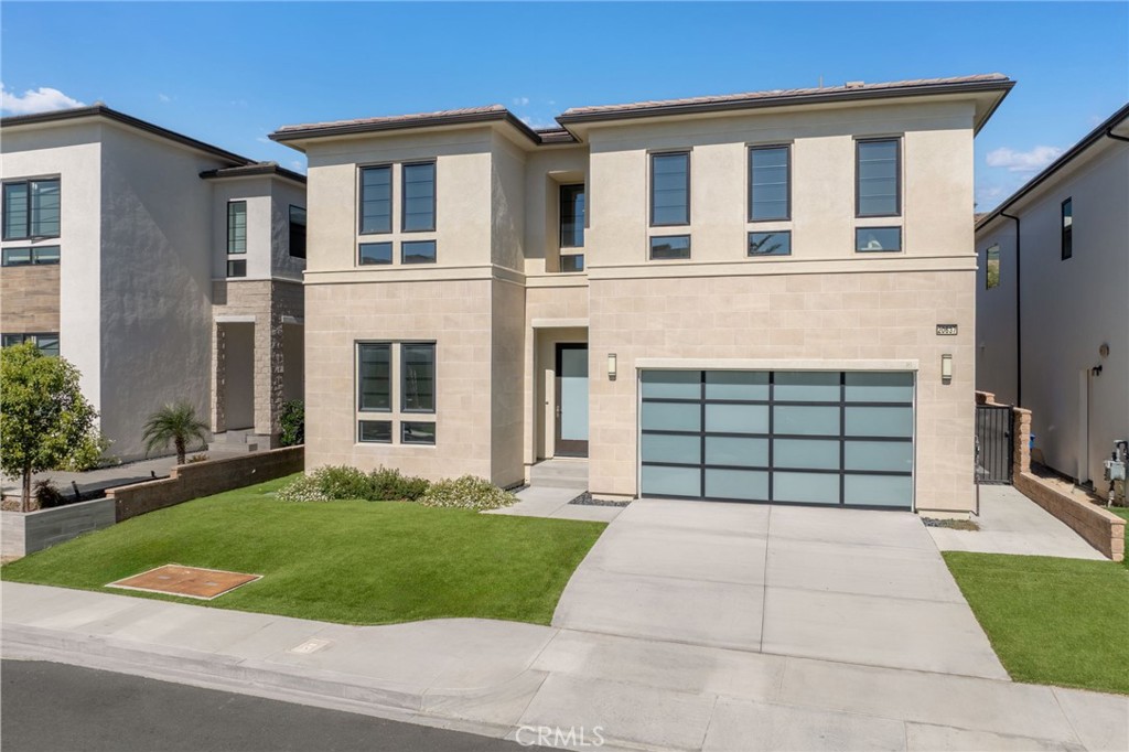 20637 West Hummingbird Porter Ranch Porter Ranch, CA 91326 - Photo 2 of 53 front view of a house with a yard