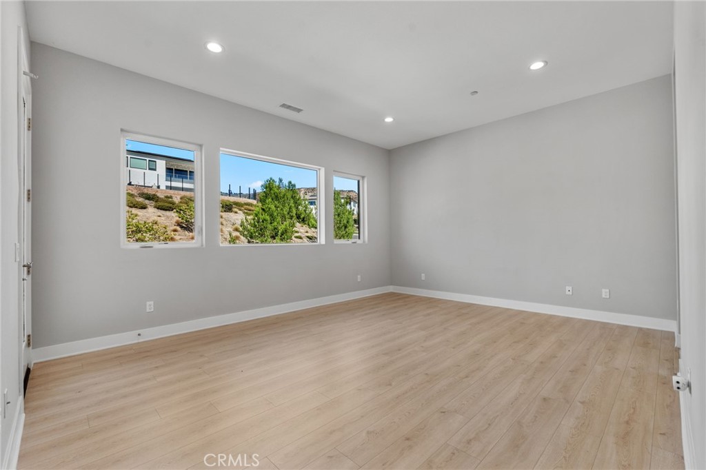 20637 West Hummingbird Porter Ranch Porter Ranch, CA 91326 - Photo 27 of 53 an empty room with windows