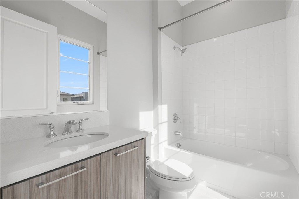 20637 West Hummingbird Porter Ranch Porter Ranch, CA 91326 - Photo 38 of 53 a bathroom with a granite countertop sink toilet and shower