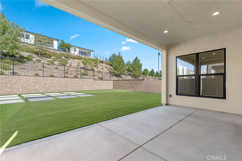20637 West Hummingbird Porter Ranch Porter Ranch, CA 91326 - Photo 47 of 53 a view of a building with a yard