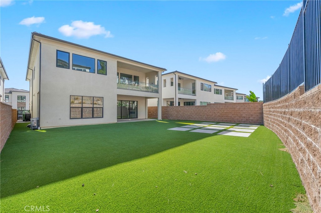 20637 West Hummingbird Porter Ranch Porter Ranch, CA 91326 - Photo 50 of 53 a front view of a house with a yard