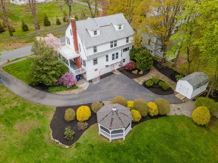 an aerial view of a house with outdoor space