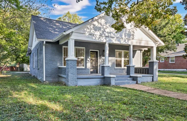 front view of a house with a yard