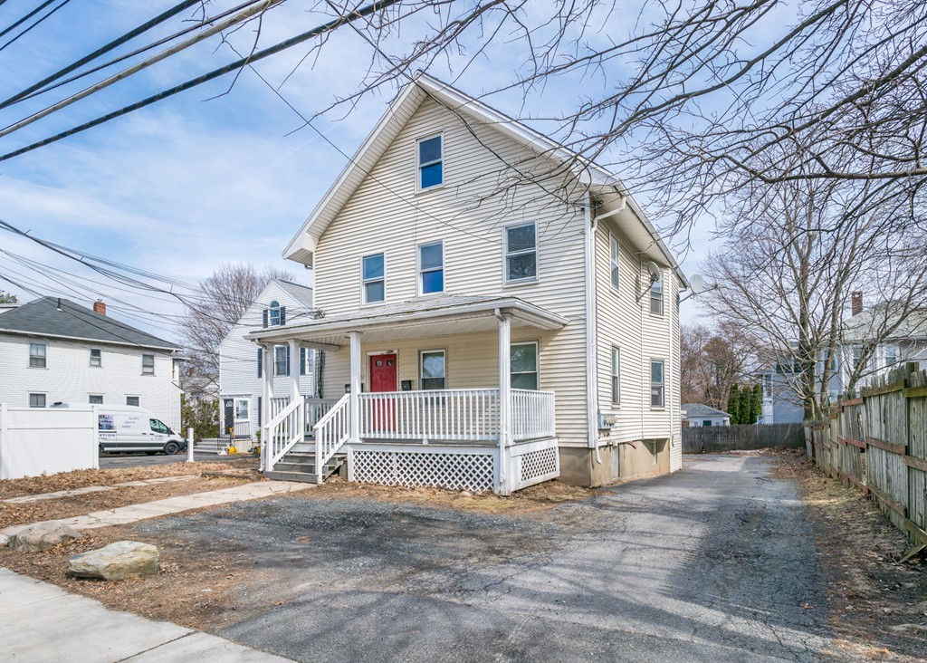 391 Concord Street Framingham, MA 01702 - Photo 1 of 27 a view of a white house with a large windows