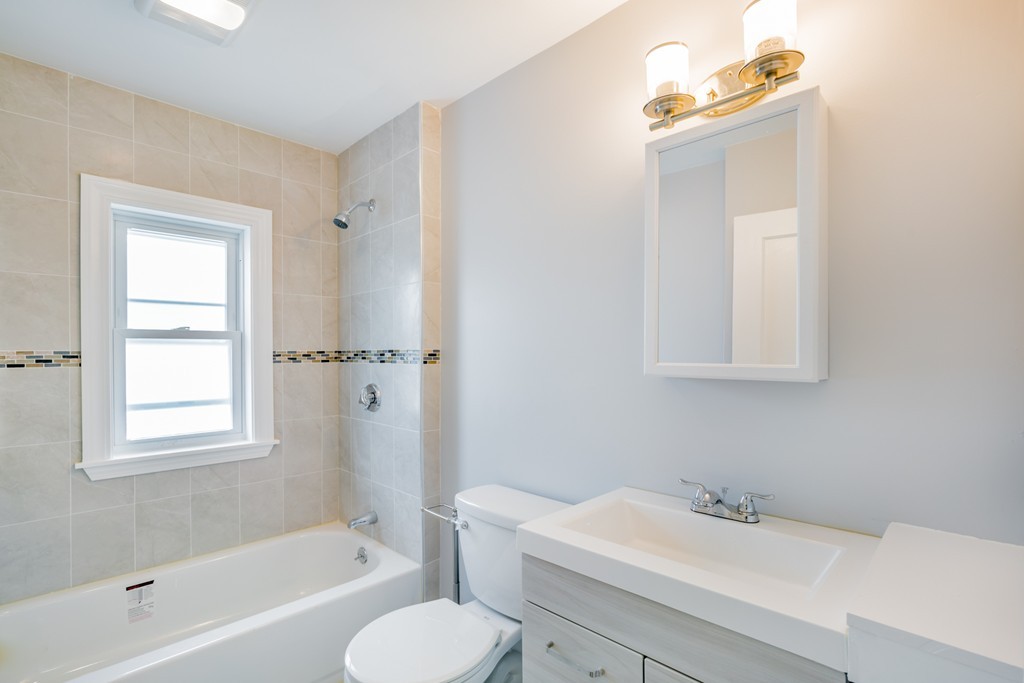 391 Concord Street Framingham, MA 01702 - Photo 16 of 27 a bathroom with a sink toilet and bathtub