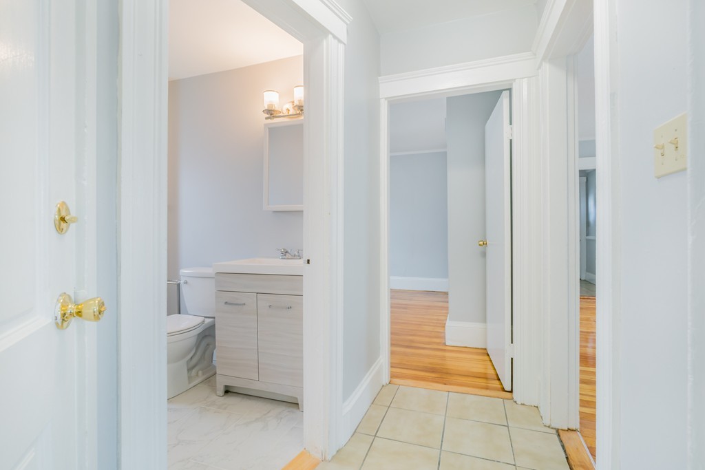 391 Concord Street Framingham, MA 01702 - Photo 17 of 27 a bathroom with a sink and a shower