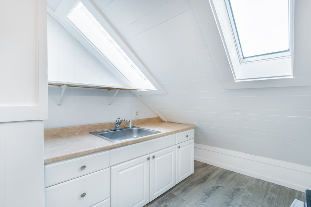 391 Concord Street Framingham, MA 01702 - Photo 21 of 27 a kitchen with a sink and a window