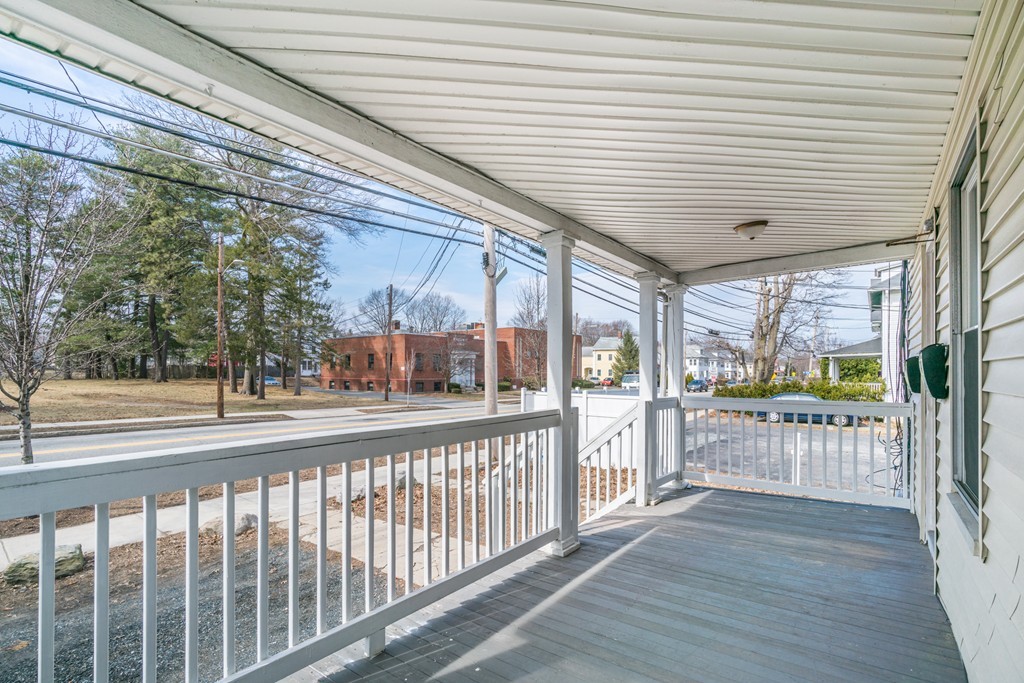 391 Concord Street Framingham, MA 01702 - Photo 3 of 27 a view of a house with a porch
