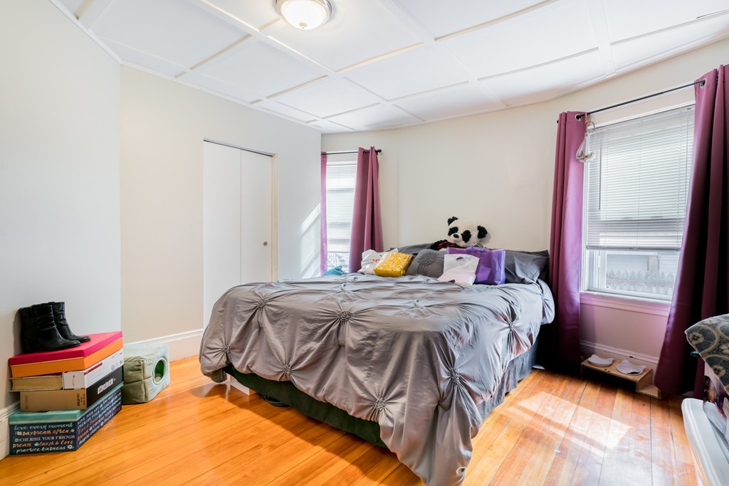 391 Concord Street Framingham, MA 01702 - Photo 9 of 27 a bedroom with a bed and a window