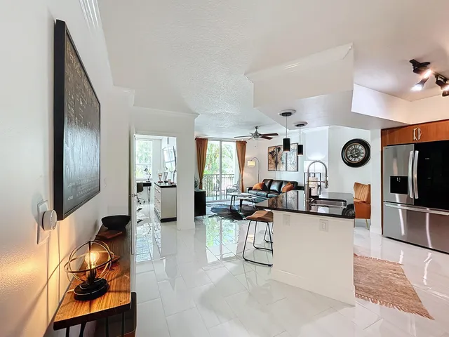 a living room with fireplace furniture and a flat screen tv