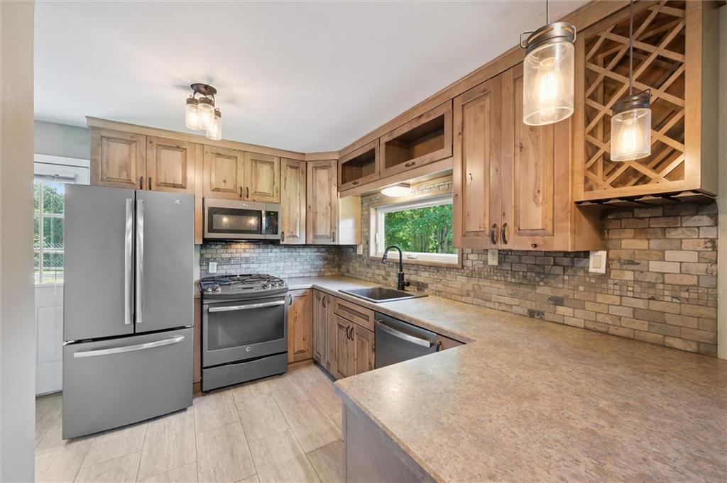2521 Hopkins Church Road Sewickley, PA 15143 - Photo 11 of 34 a kitchen with granite countertop a sink stainless steel appliances and cabinets