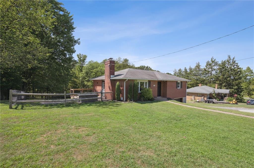 2521 Hopkins Church Road Sewickley, PA 15143 - Photo 2 of 34 a view of a house with a big yard and sitting area