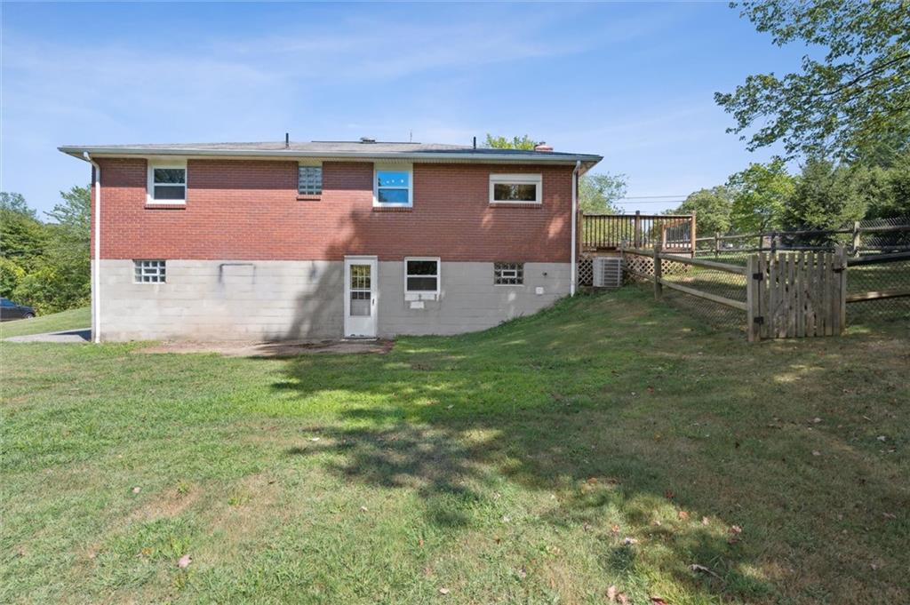2521 Hopkins Church Road Sewickley, PA 15143 - Photo 26 of 34 a front view of house with yard and trees in the background