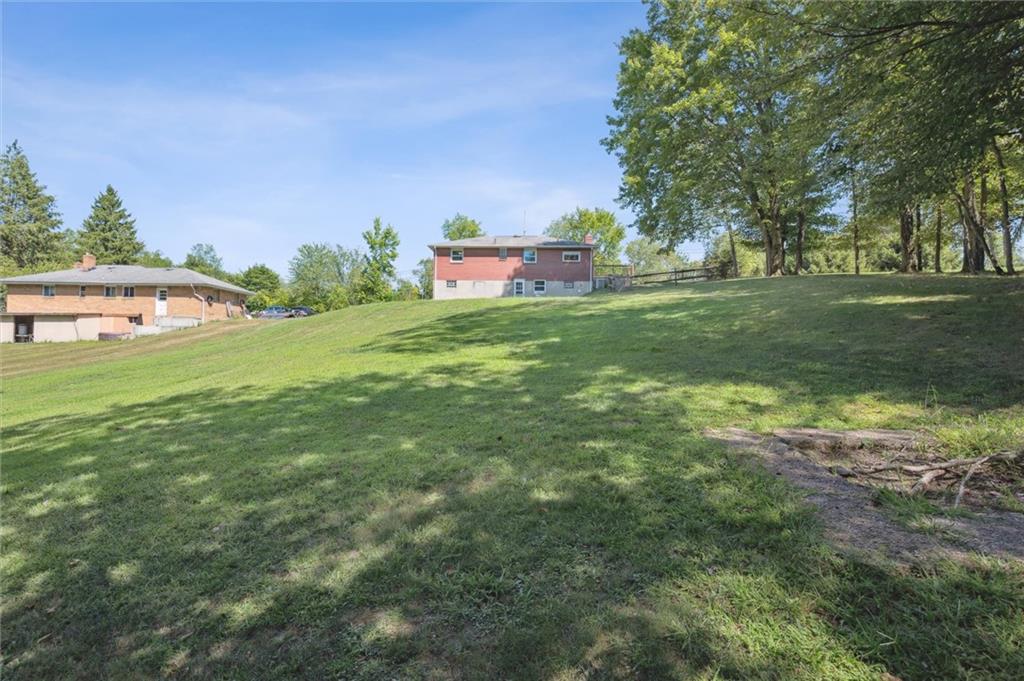 2521 Hopkins Church Road Sewickley, PA 15143 - Photo 30 of 34 a backyard of a house with table and chairs