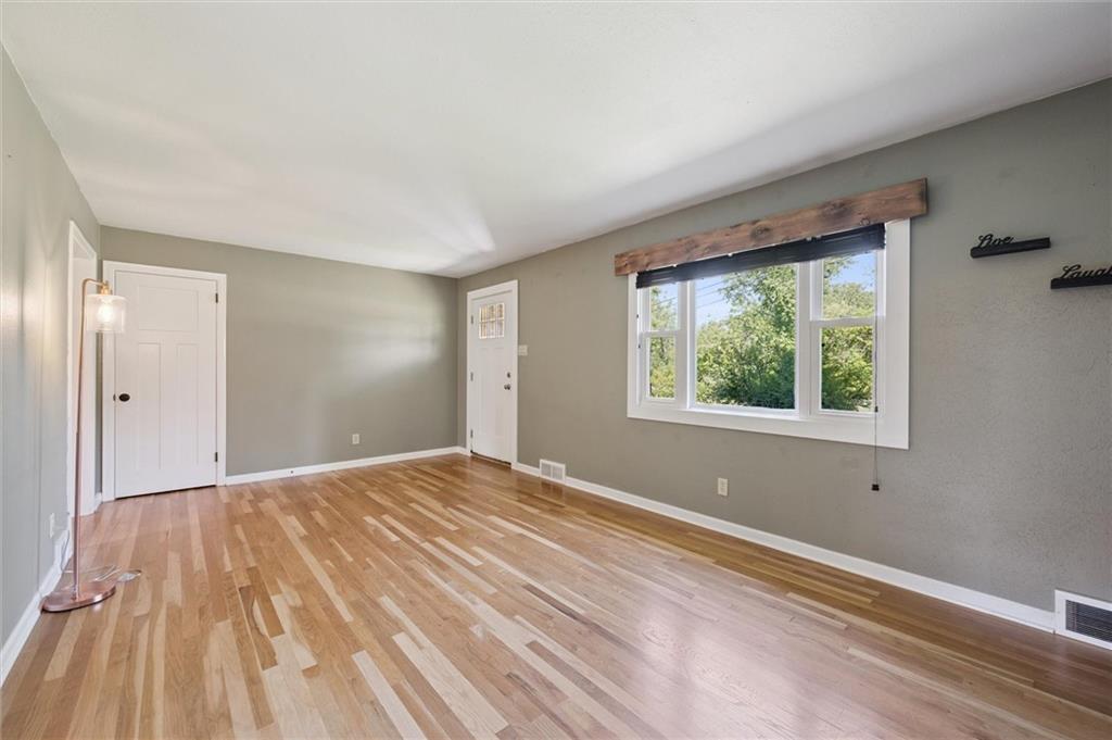 2521 Hopkins Church Road Sewickley, PA 15143 - Photo 6 of 34 a view of an empty room with wooden floor and a window