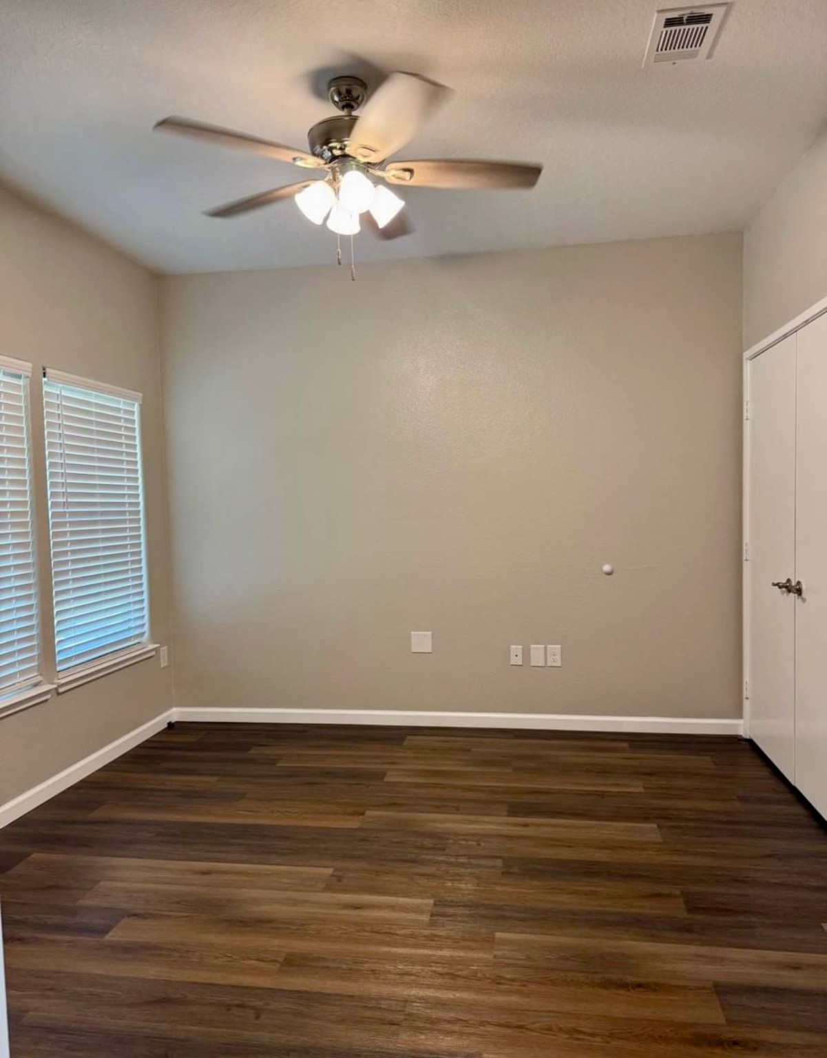 4741 Providence Street Houston, TX 77020 - Photo 13 of 22 a view of an empty room with wooden floor and a ceiling fan