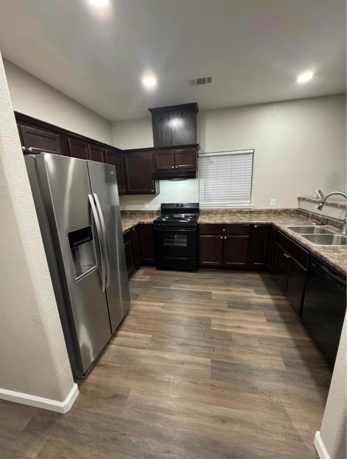 4741 Providence Street Houston, TX 77020 - Photo 3 of 22 a large kitchen with a sink and refrigerator