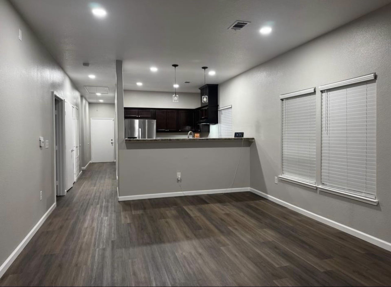 4741 Providence Street Houston, TX 77020 - Photo 4 of 22 a view of a kitchen with a sink and a refrigerator