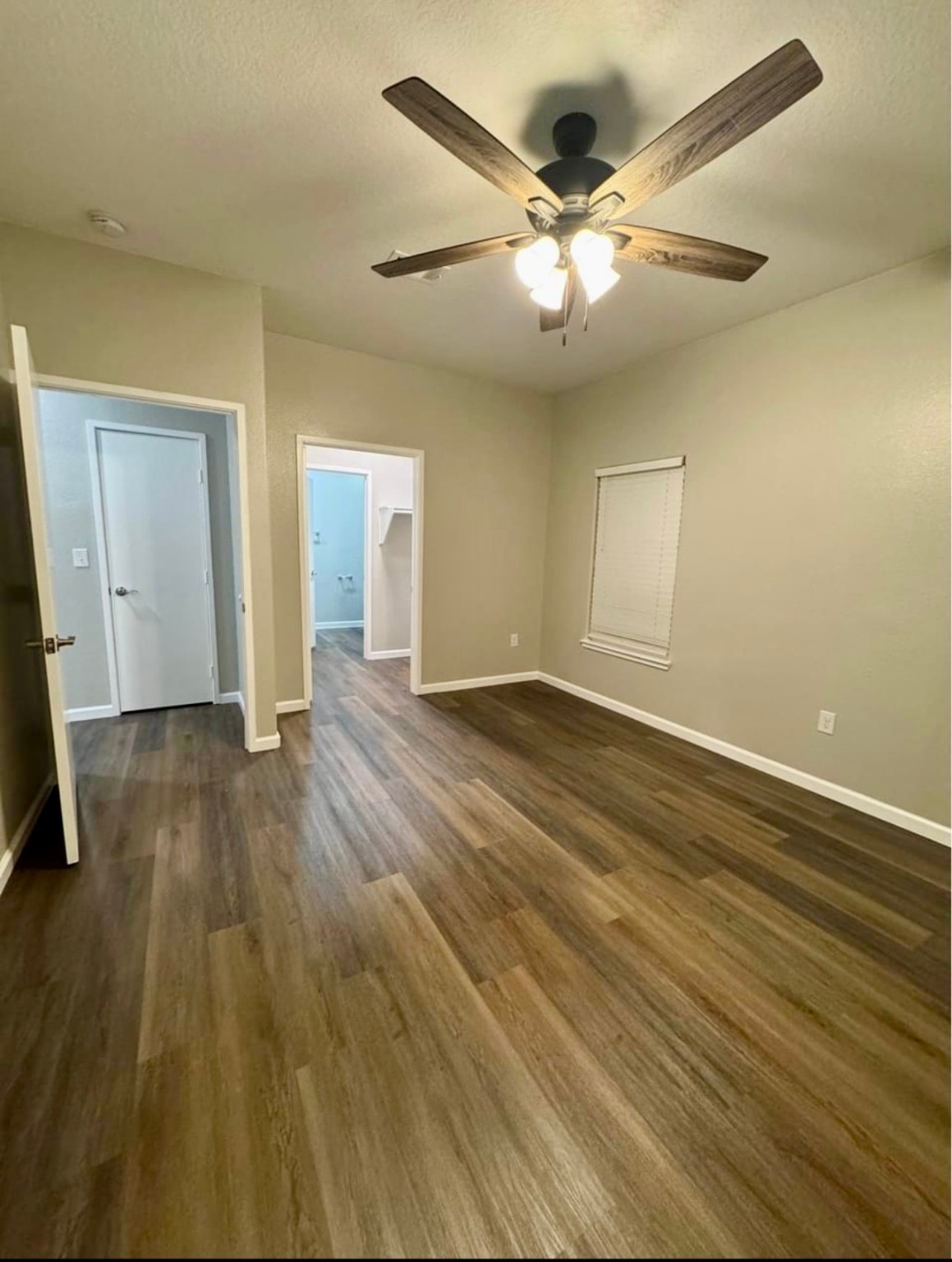 4741 Providence Street Houston, TX 77020 - Photo 8 of 22 wooden floor in an empty room with a window