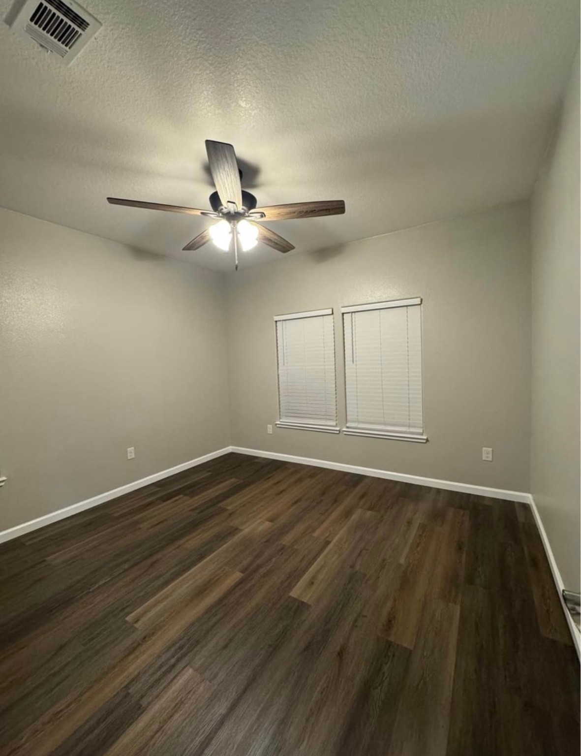 4741 Providence Street Houston, TX 77020 - Photo 9 of 22 a view of an empty room with wooden floor