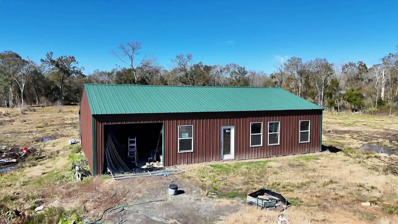 7072 County Road 3 Sweeny, TX 77480 - Photo 1 of 23 a front view of a house with garden