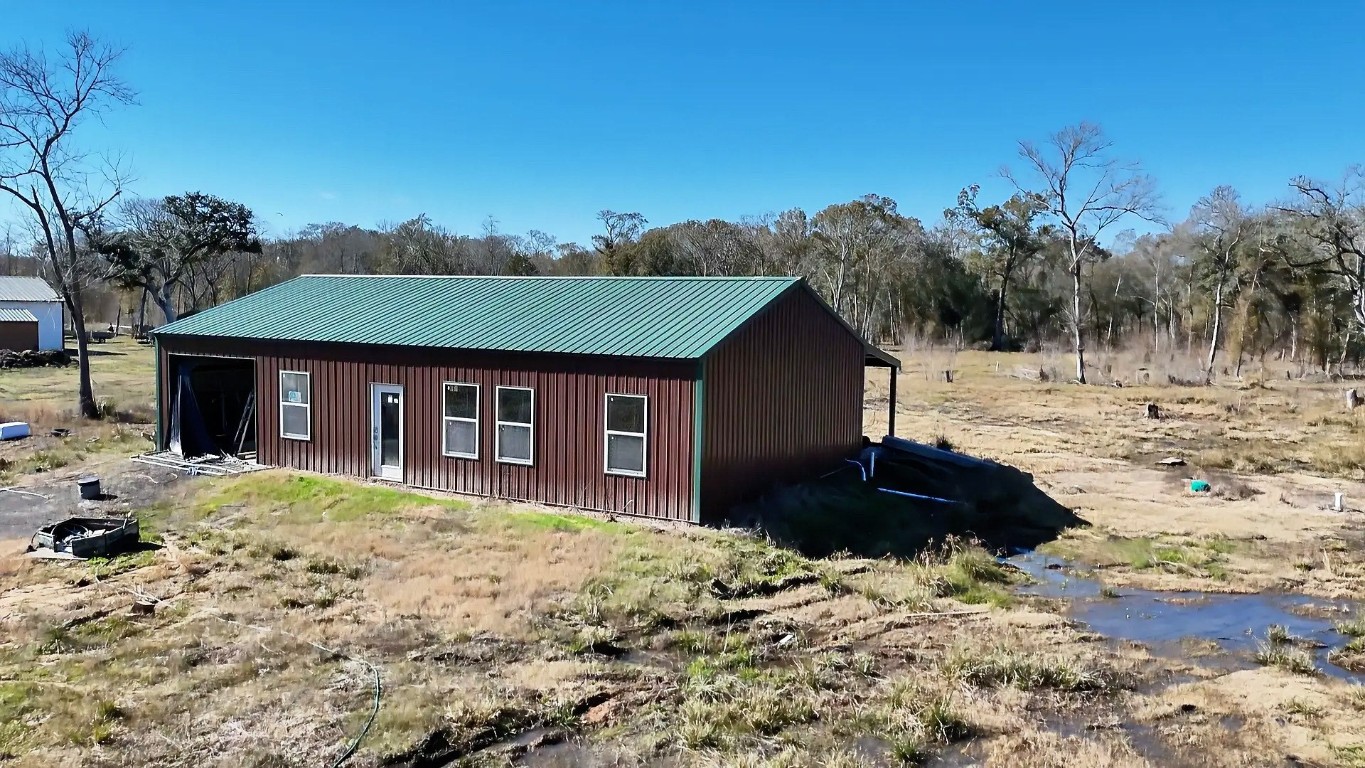 7072 County Road 3 Sweeny, TX 77480 - Photo 2 of 23 a front view of a house with a yard
