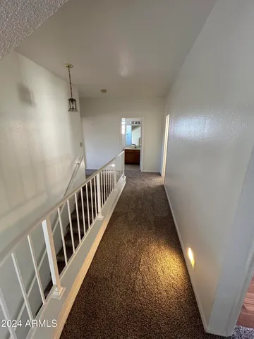 a view of a hallway with entryway