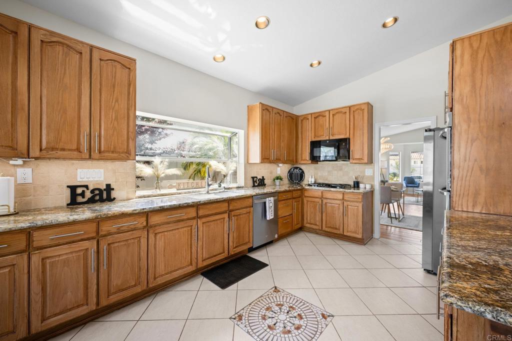 342 Benevente Drive Oceanside, CA 92057 - Photo 12 of 43 a large kitchen with a window