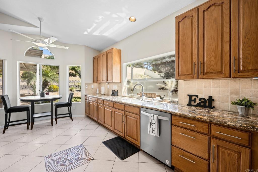 342 Benevente Drive Oceanside, CA 92057 - Photo 16 of 43 a kitchen with a sink stove and cabinets