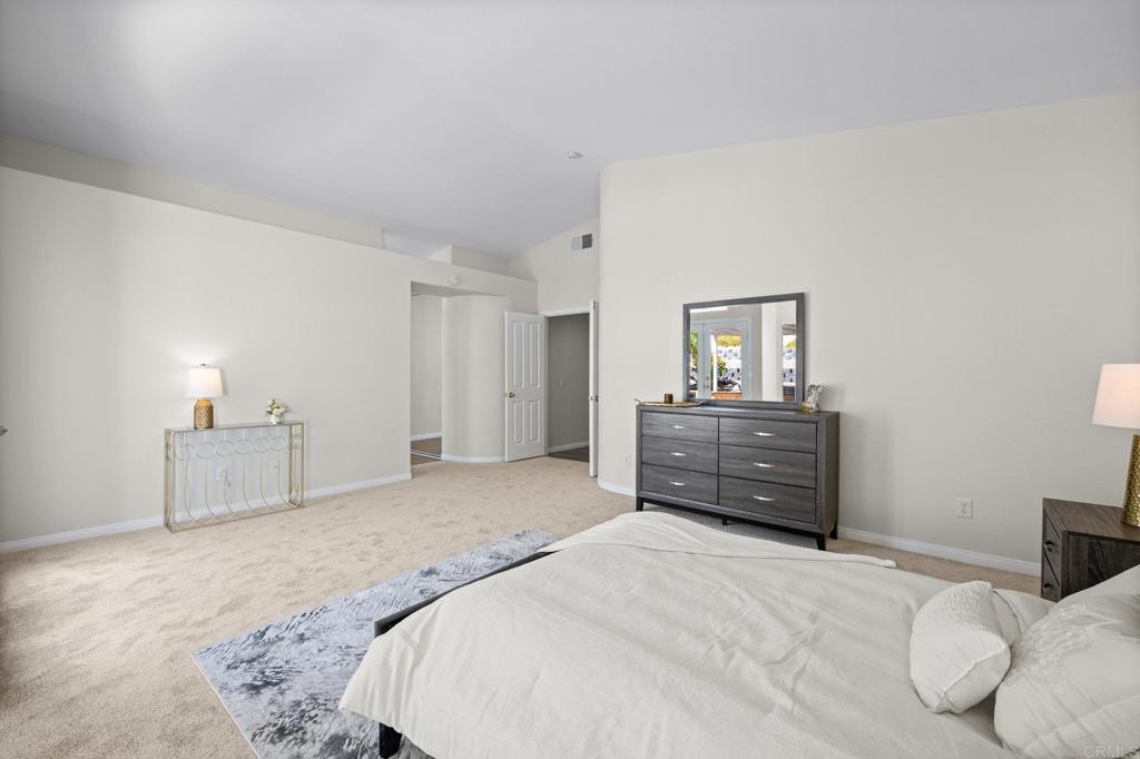 342 Benevente Drive Oceanside, CA 92057 - Photo 27 of 43 a bedroom with a bed and a dresser