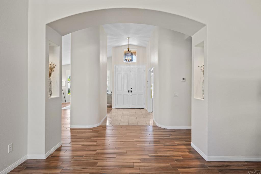342 Benevente Drive Oceanside, CA 92057 - Photo 7 of 43 a view of an empty room with wooden floor