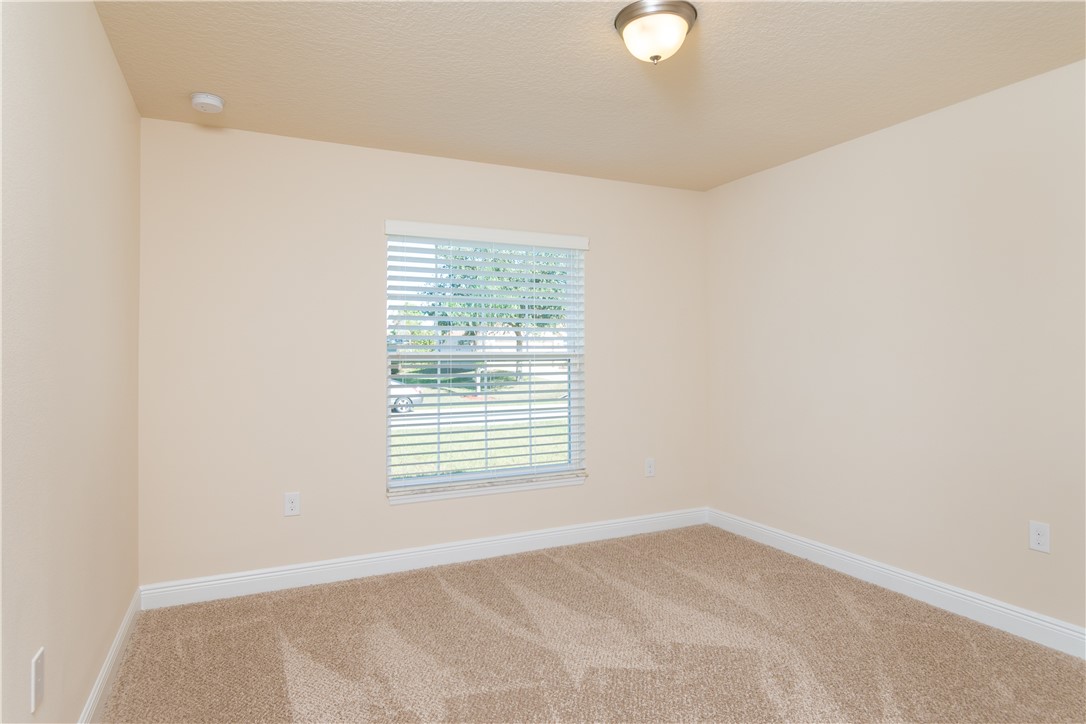 1361 Seahouse Street Sebastian, FL 32958 - Photo 11 of 13 a view of an empty room with a window