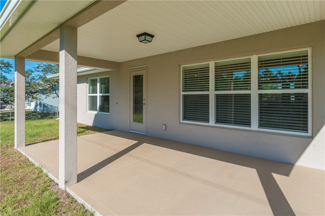 1361 Seahouse Street Sebastian, FL 32958 - Photo 13 of 13 a view of backyard with large tree